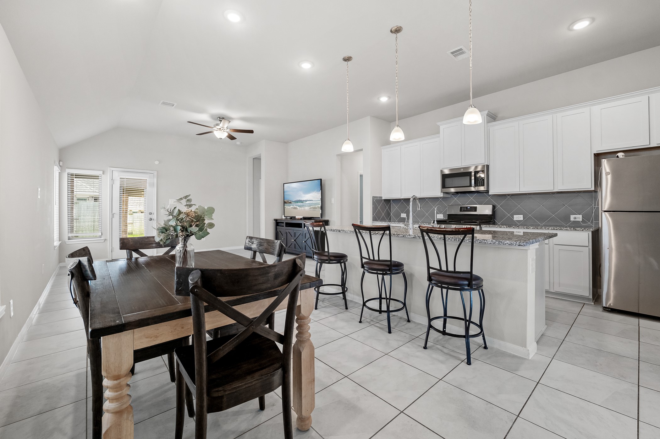3722 Amoroso Drive Rosharon, TX 77583 - Photo 7 of 27 a view of a dining room with furniture