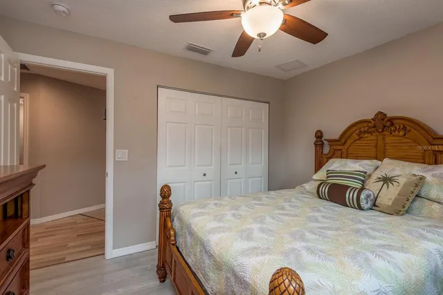a bathroom with a granite countertop sink and a window