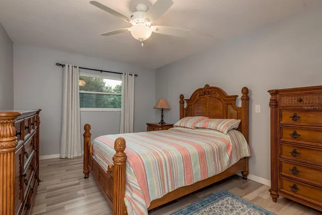a balcony with furniture and a potted plant