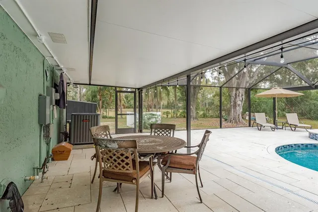 a view of house with garden and deck