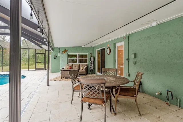 a view of a park with large trees