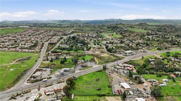 an aerial view of residential houses with outdoor space and river