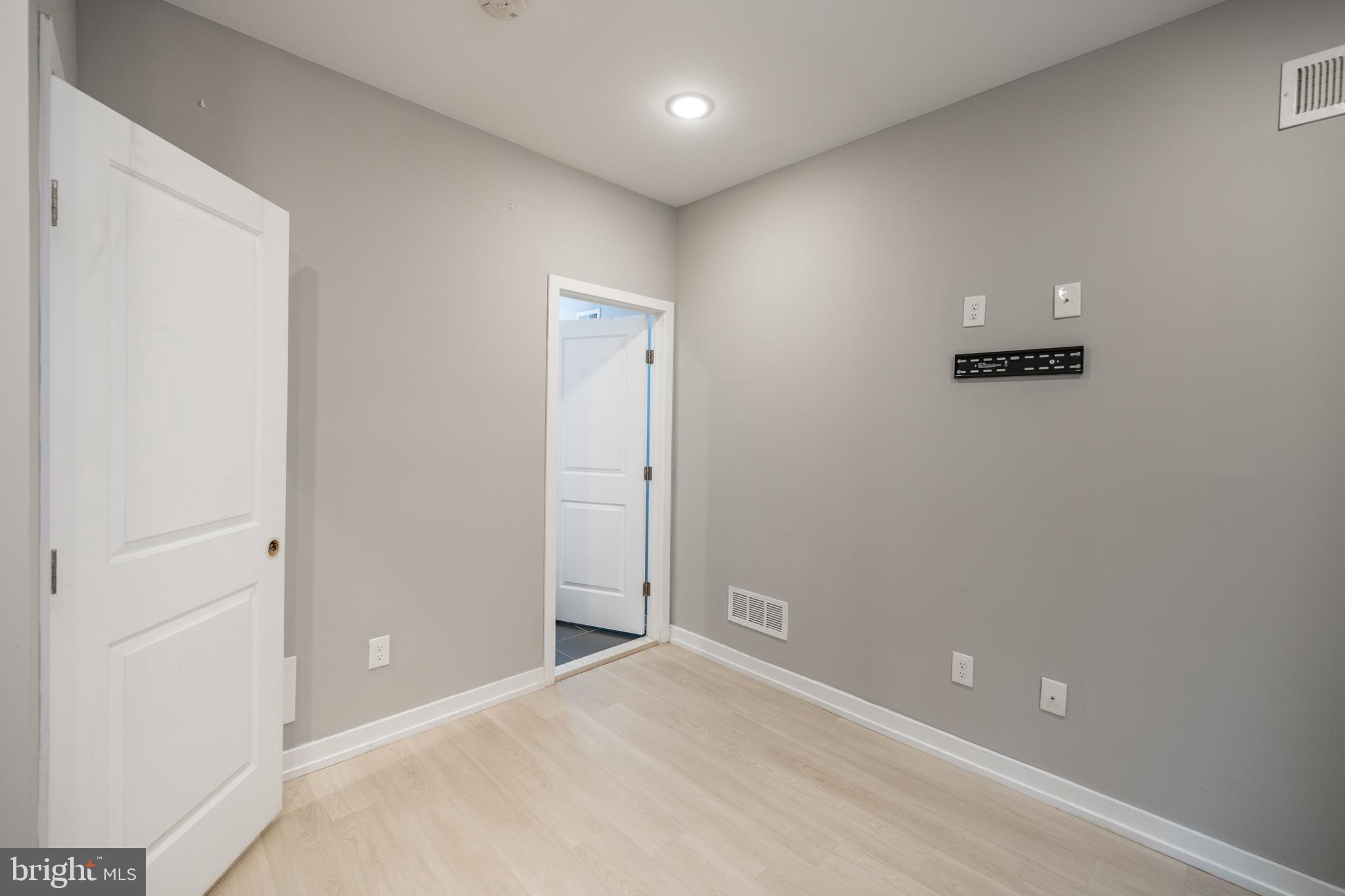 2428 Jasper Street, Unit A Philadelphia, PA 19125 - Photo 21 of 26 an empty room with windows