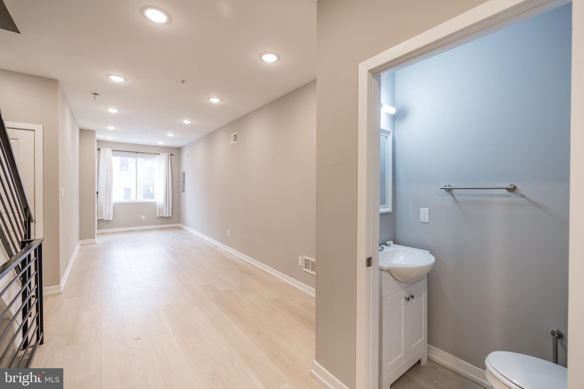 2428 Jasper Street, Unit A Philadelphia, PA 19125 - Photo 9 of 26 a bathroom with a toilet and a sink