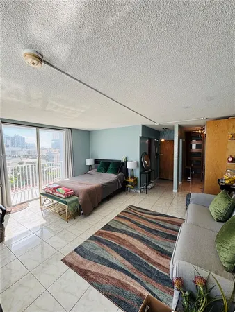 a bedroom with double bed and a large window