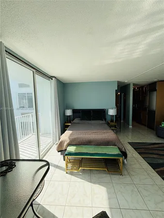 a bedroom with a bed and a mirror