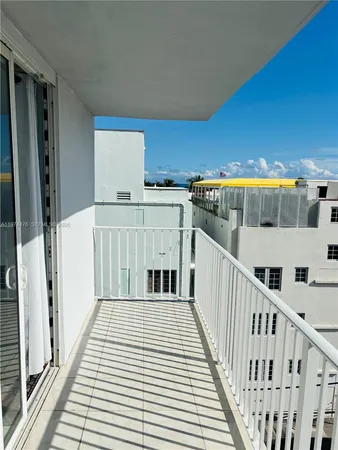 a view of a balcony with wooden floor
