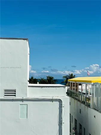a view of a balcony with an outdoor seating