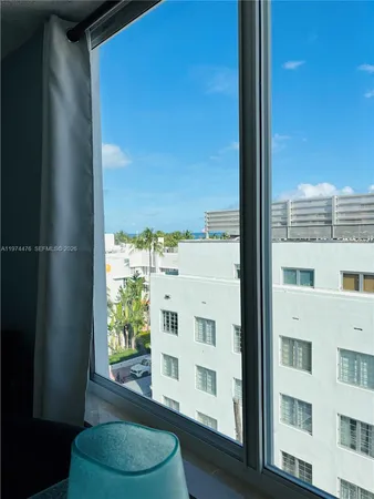 a view of a living room with a large window