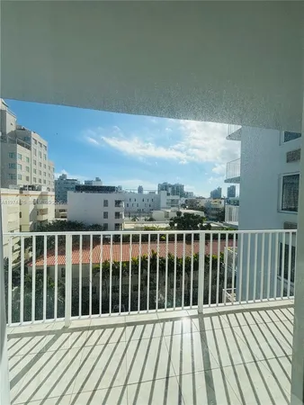 a view of balcony with wooden floor