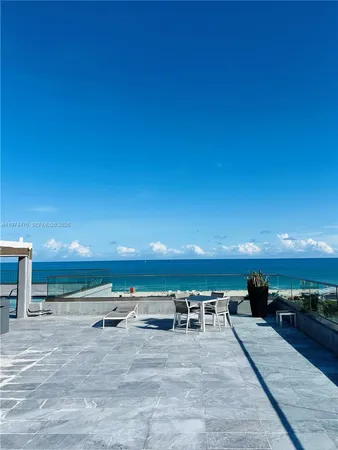 a view of swimming pool with furniture