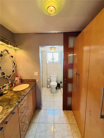 a spacious bathroom with a double vanity sink and a mirror