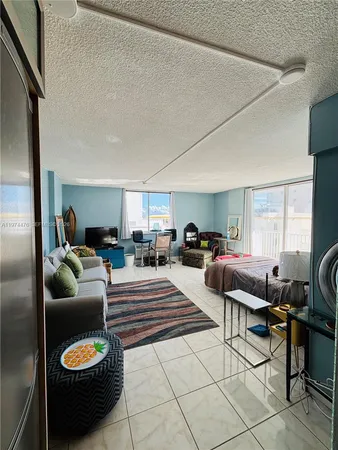 a living room with furniture and a chair