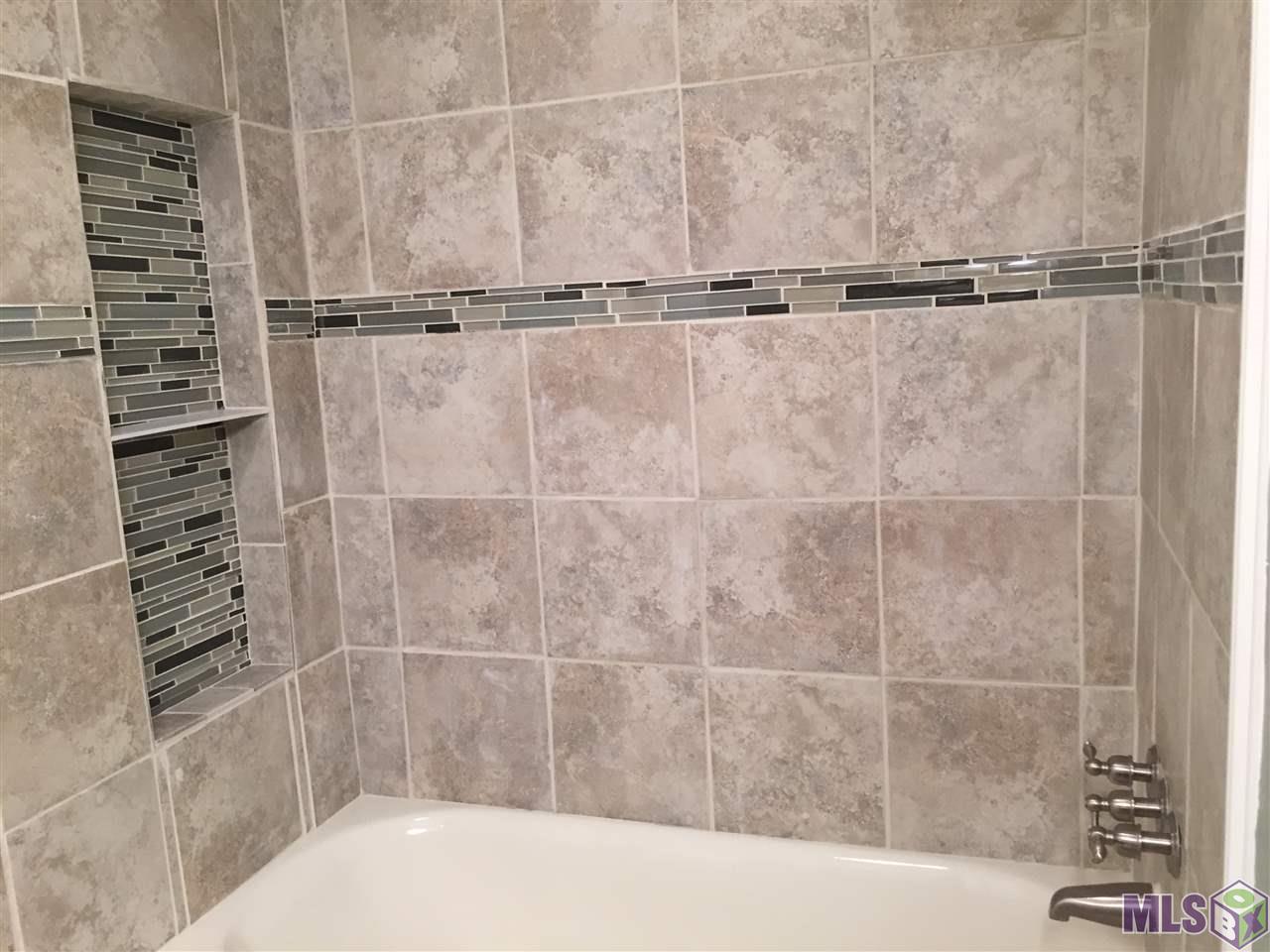 11139 Stanley Aubin Lane Baton Rouge, LA 70816 - Photo 12 of 24 Beautiful tile work around tub