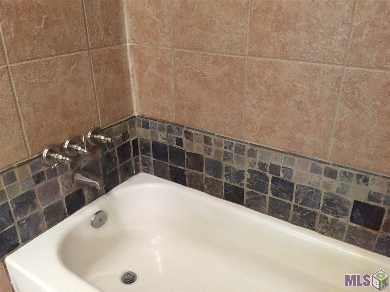 11139 Stanley Aubin Lane Baton Rouge, LA 70816 - Photo 16 of 24 Additional tile work at tub