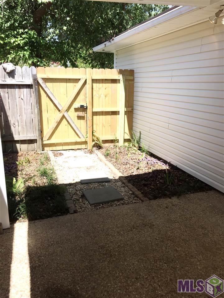 11139 Stanley Aubin Lane Baton Rouge, LA 70816 - Photo 20 of 24 Open patio to front of home