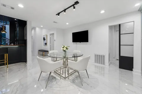 a bedroom with a bed and large window