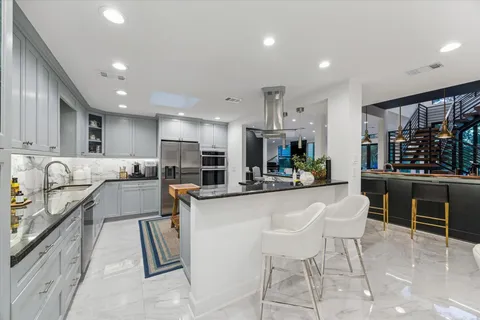 a bathroom with a granite countertop sink a shower and a mirror