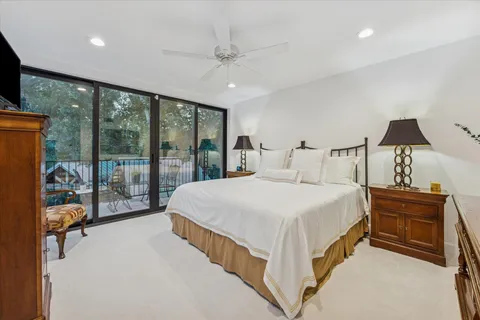 a bedroom with a bed and a night stand