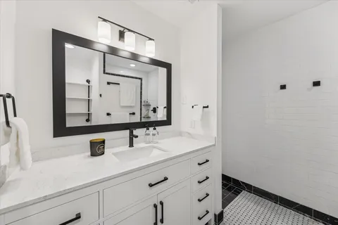 a view of a patio with table and chairs potted plants with wooden floor and fence