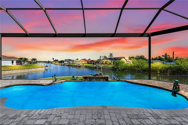 a view of swimming pool with outdoor seating and city view