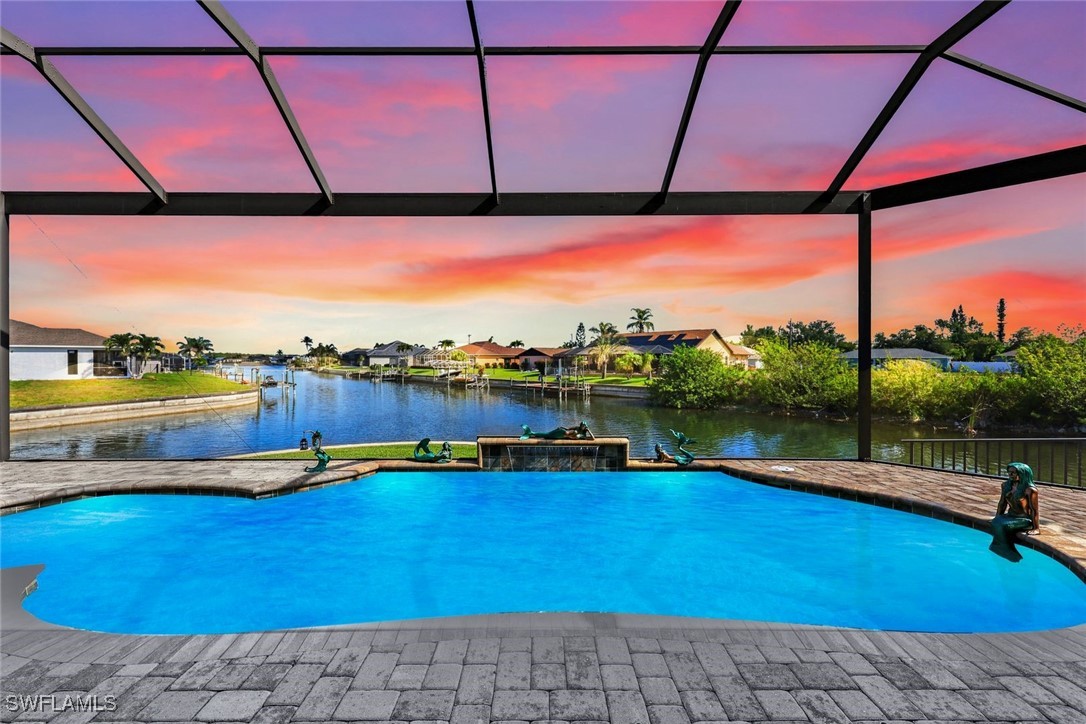 a view of swimming pool with outdoor seating and city view