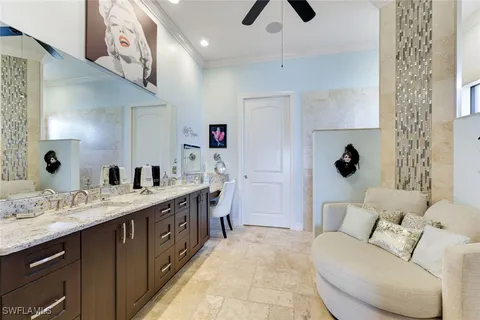 a spacious bathroom with a double vanity sink a mirror and shower