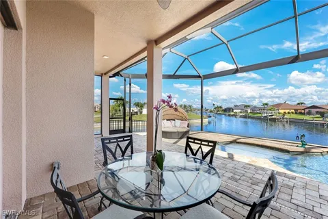a view of a chairs and table in the patio