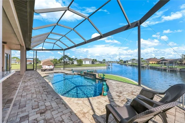 a view of swimming pool with seating area