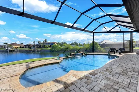 a view of a swimming pool with a patio