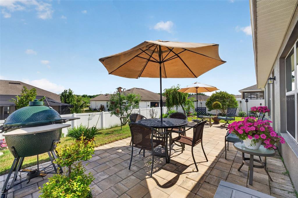 2429 Twin Lake View Road Winter Haven, FL 33881 - Photo 28 of 37 a view of an outdoor sitting area with furniture and umbrella