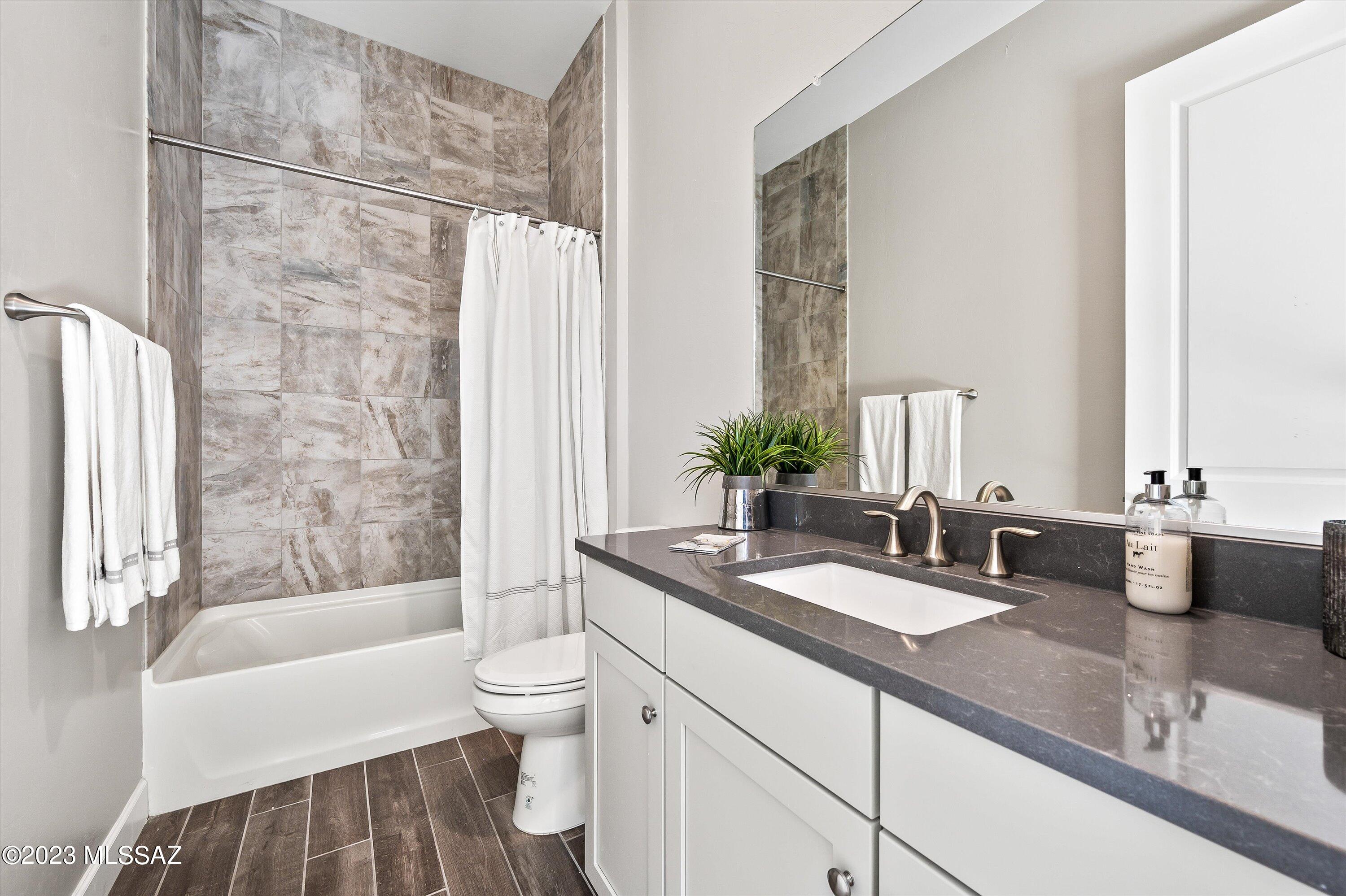 13169 North Vistoso Rnch Place Oro Valley, AZ 85755 - Photo 20 of 29 a bathroom with a granite countertop sink and a mirror