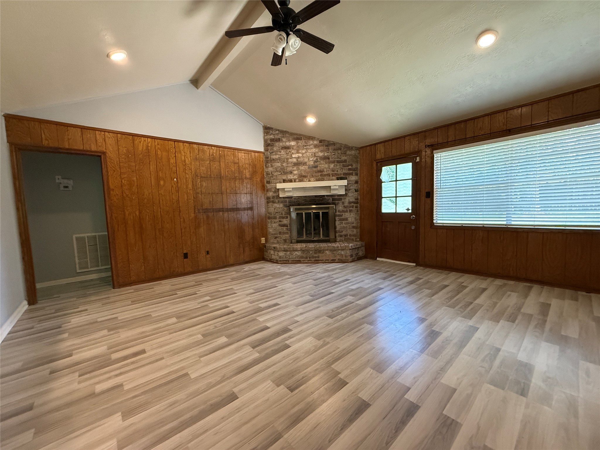422 Gamewood Drive Spring, TX 77386 - Photo 12 of 25 a view of an empty room with a fireplace and a window