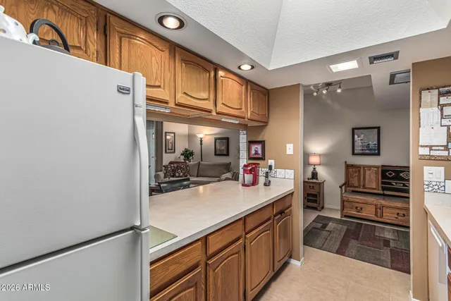 a kitchen with stainless steel appliances a sink and cabinets