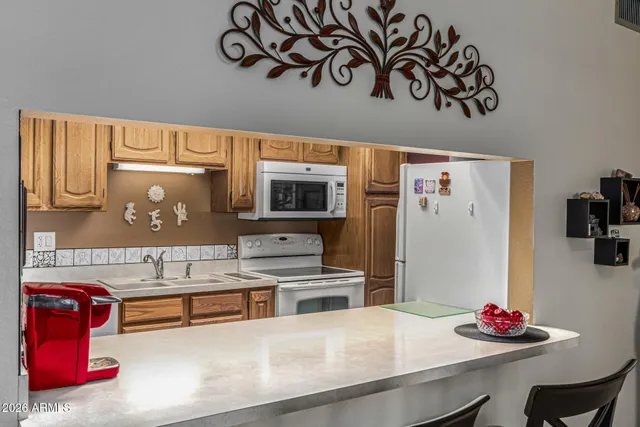 a kitchen with stainless steel appliances granite countertop a sink and cabinets