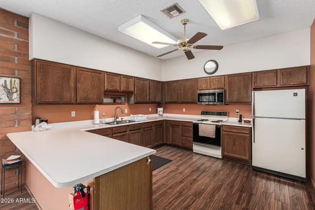 a kitchen with a sink a stove and refrigerator