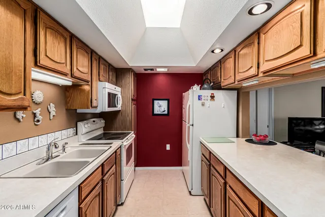 a kitchen that has a lot of cabinets in it