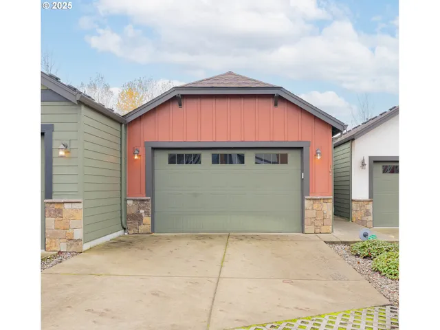 a front view of a house with a garage