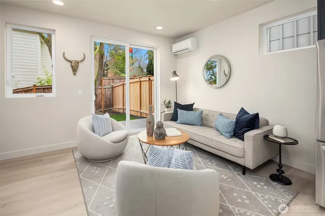 a living room with furniture and a large window