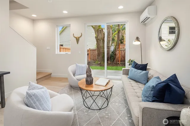 a living room with furniture and a large window