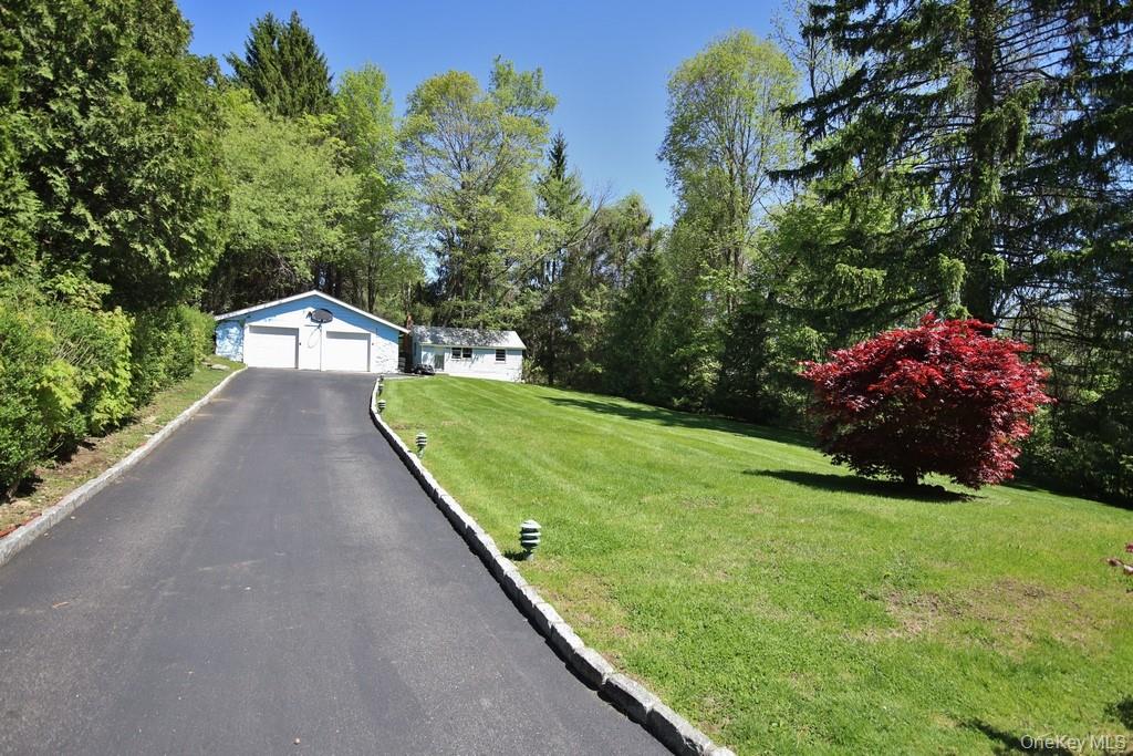 30 Granite Springs Road Granite Springs, NY 10527 - Photo 35 of 37 a view of a backyard with potted plants and large trees