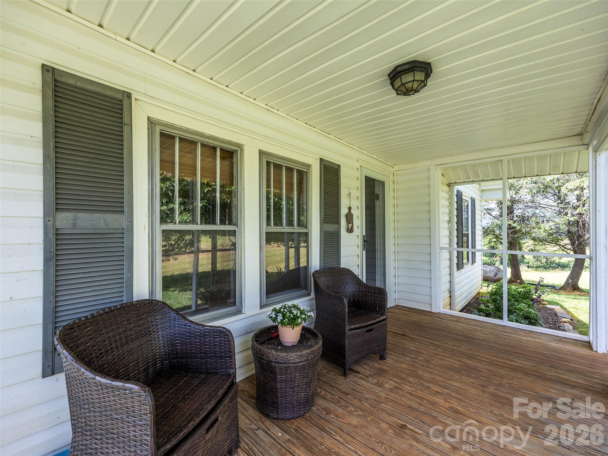 1305 Halltown Road Spruce Pine, NC 28777 - Photo 21 of 45 a balcony with furniture and a potted plant