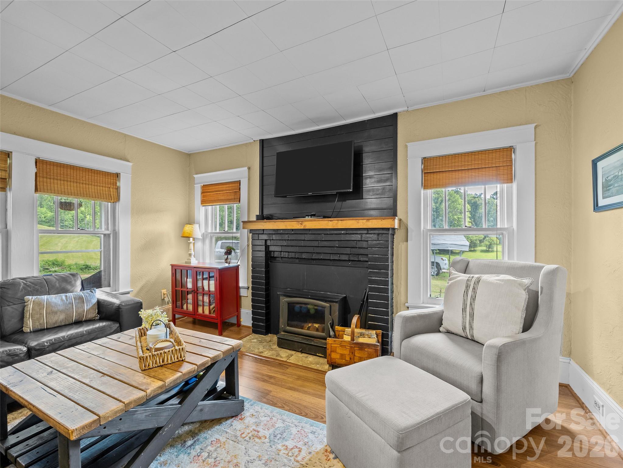 1305 Halltown Road Spruce Pine, NC 28777 - Photo 27 of 45 a living room with furniture fireplace and flat screen tv