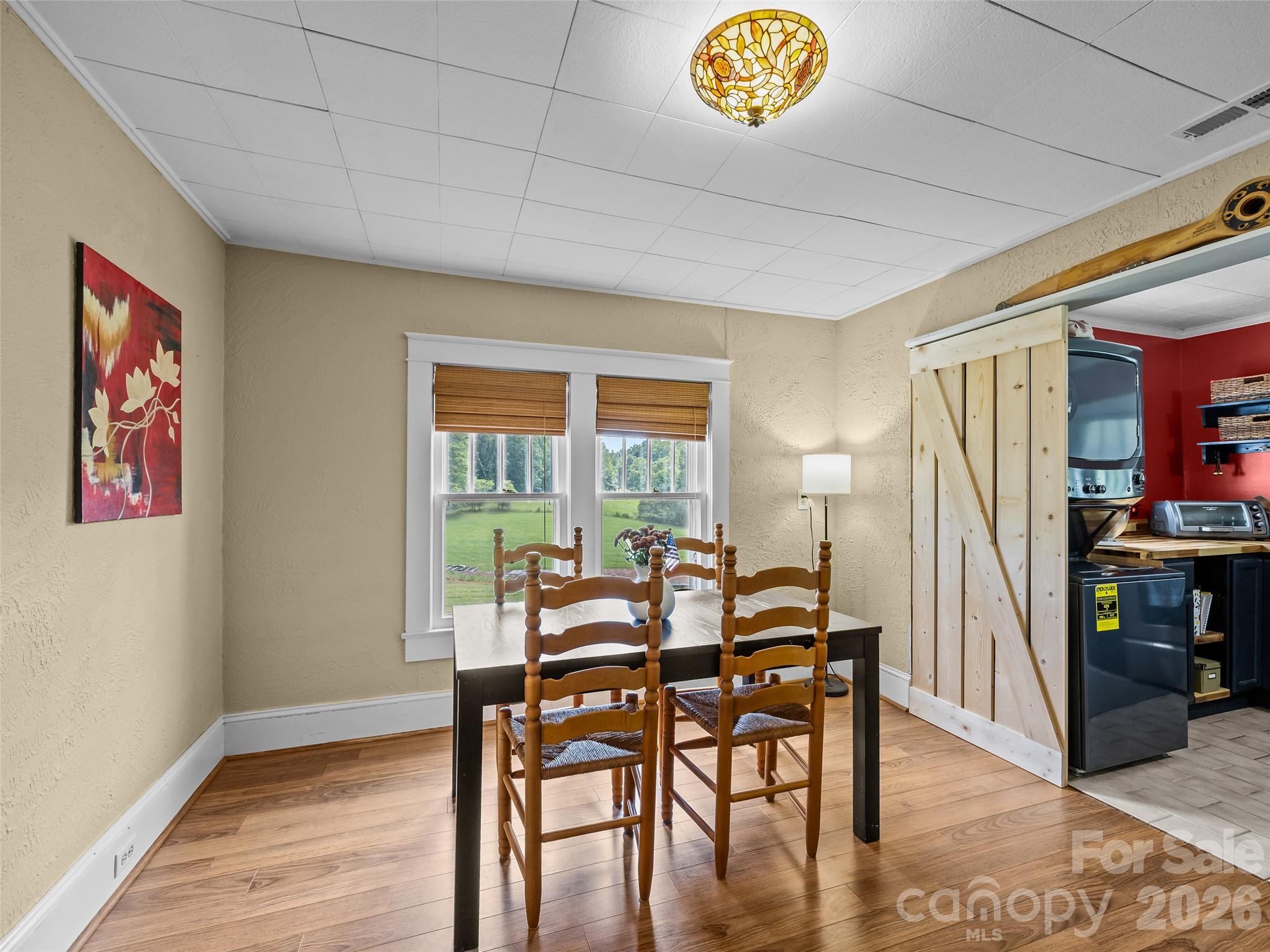 1305 Halltown Road Spruce Pine, NC 28777 - Photo 29 of 45 a view of a dining room with furniture window and wooden floor