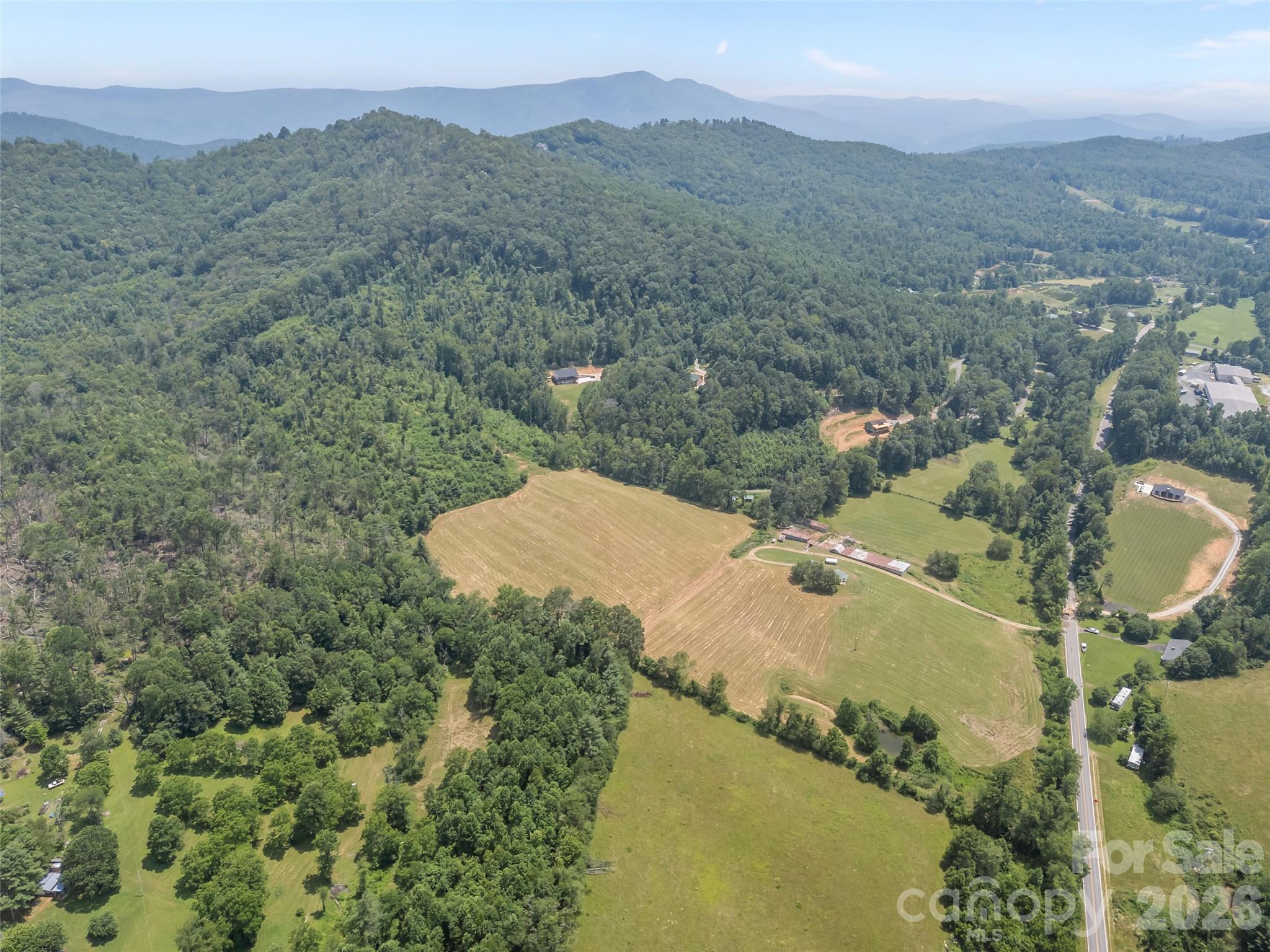 1305 Halltown Road Spruce Pine, NC 28777 - Photo 3 of 45 an aerial view of residential houses with outdoor space and trees