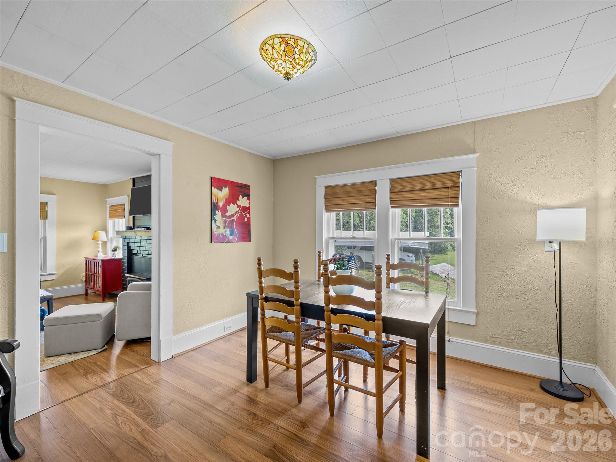 1305 Halltown Road Spruce Pine, NC 28777 - Photo 32 of 45 a view of a dining room with furniture window and wooden floor