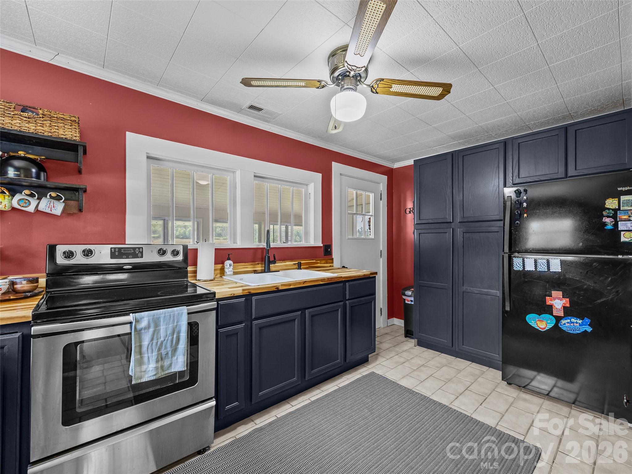 1305 Halltown Road Spruce Pine, NC 28777 - Photo 35 of 45 a kitchen with a stove and a refrigerator