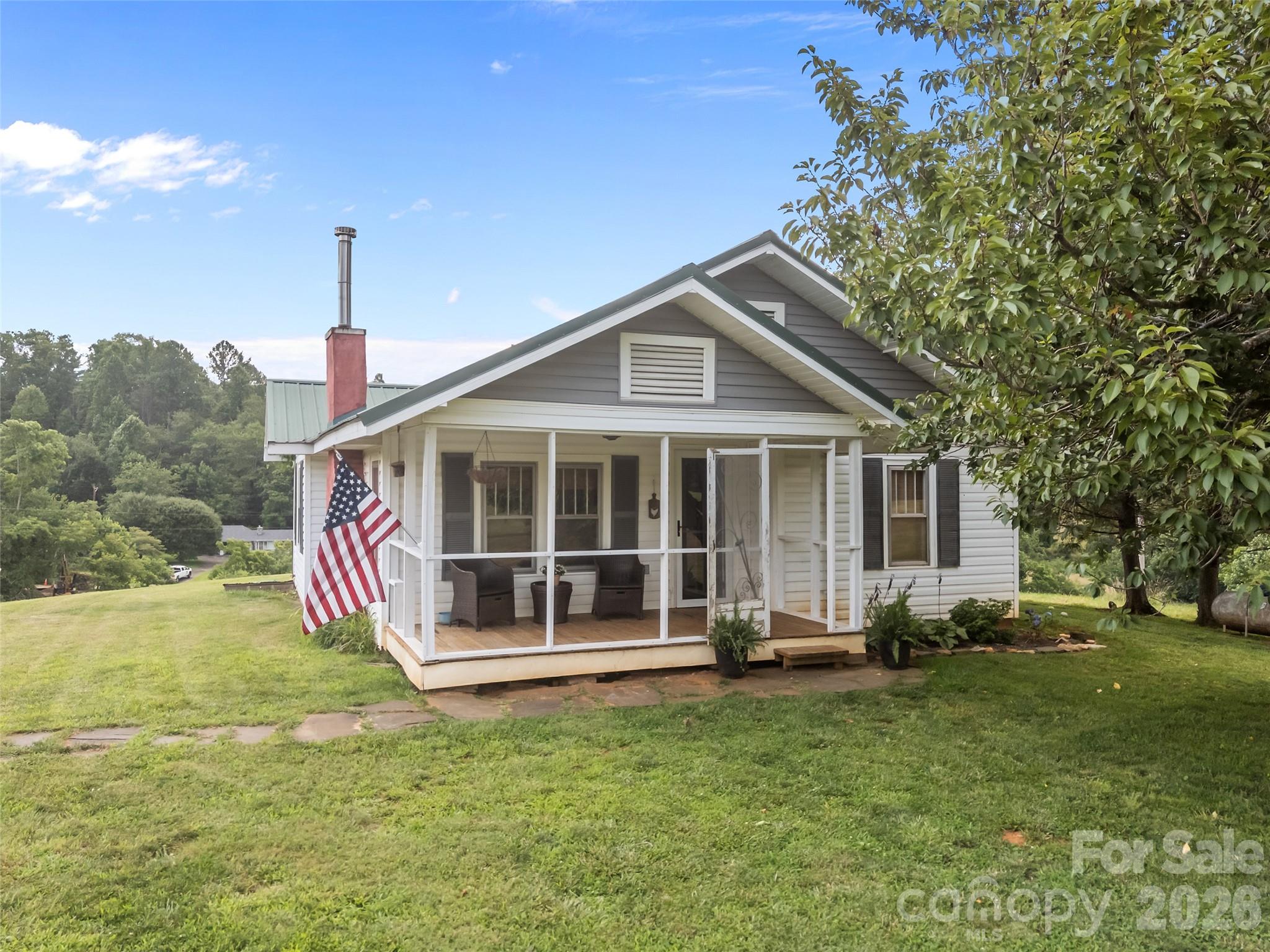 1305 Halltown Road Spruce Pine, NC 28777 - Photo 38 of 45 a front view of a house with a yard