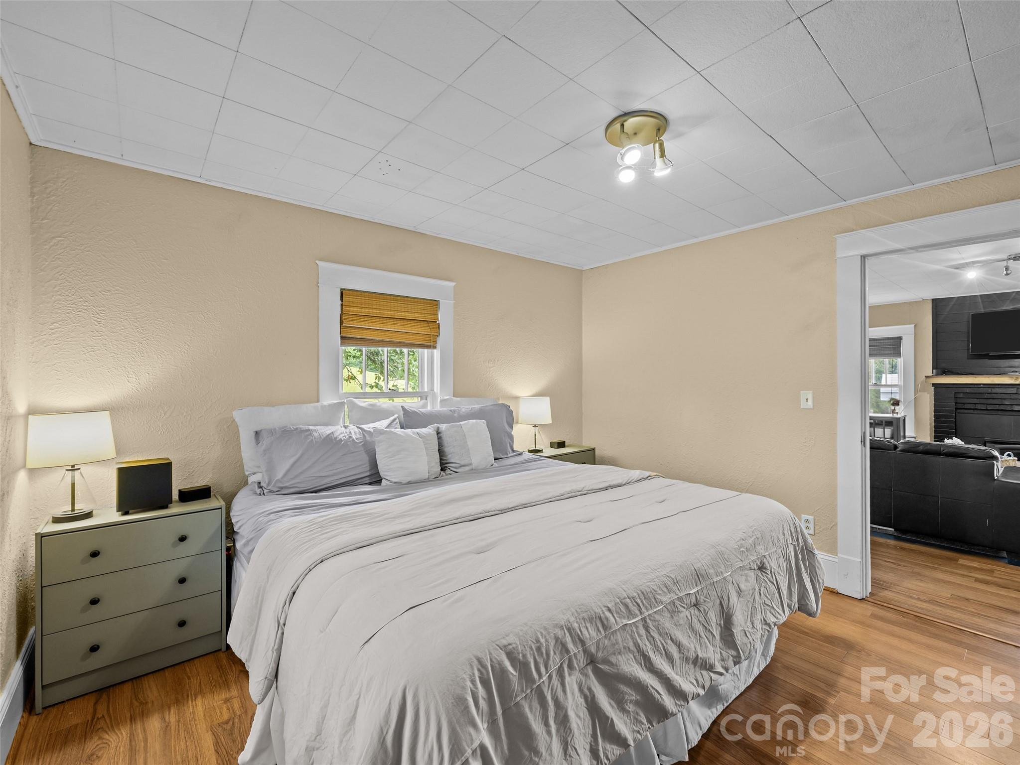 1305 Halltown Road Spruce Pine, NC 28777 - Photo 41 of 45 a bedroom with a bed and a night stand