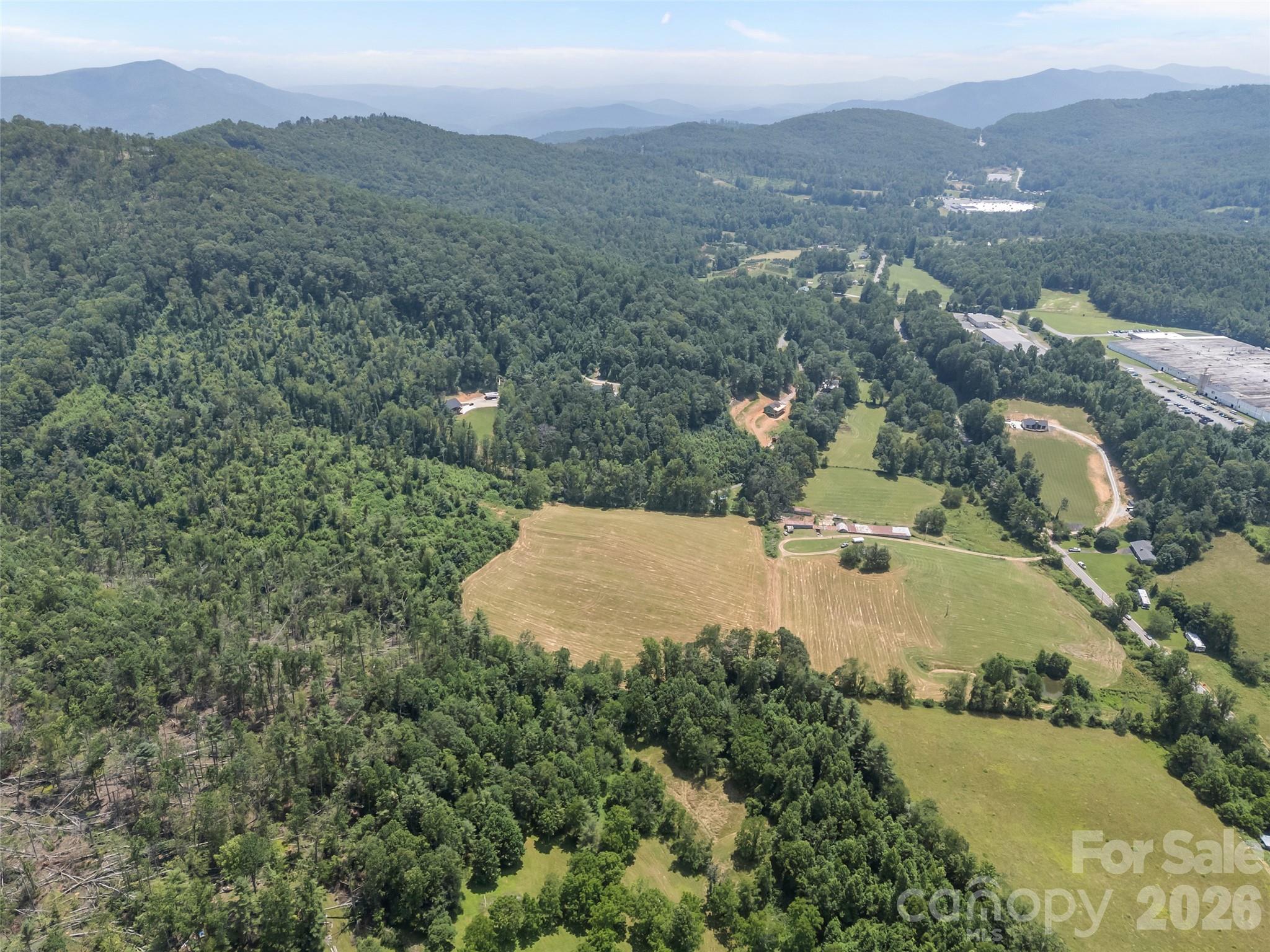 1305 Halltown Road Spruce Pine, NC 28777 - Photo 7 of 45 an aerial view of residential houses with outdoor space and trees